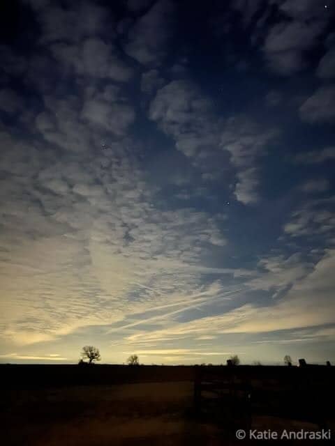Dramatic sky with dense clouds at sunset or sunrise.